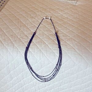 Long silver chain necklace.